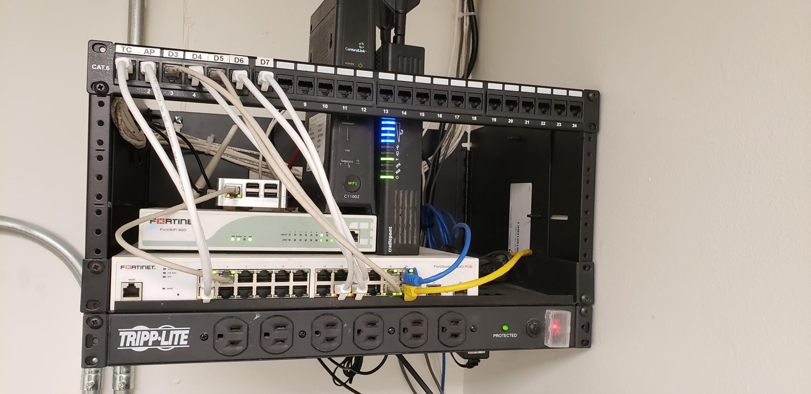 Wall rack switch patch panel installed by All Soul Tech in Colorado