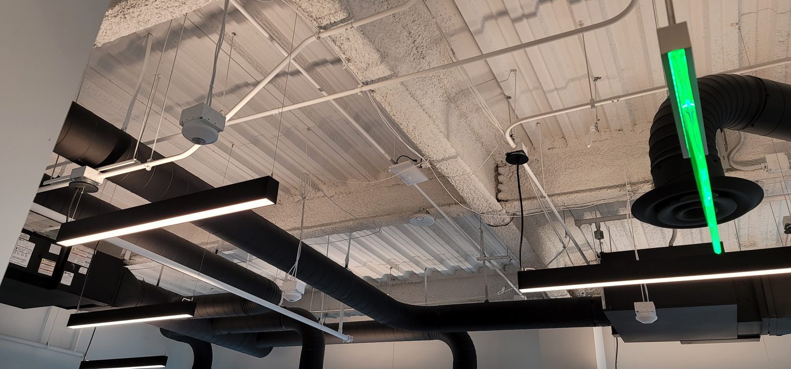 Open ceiling office cabling installed by All Soul Tech in Colorado
