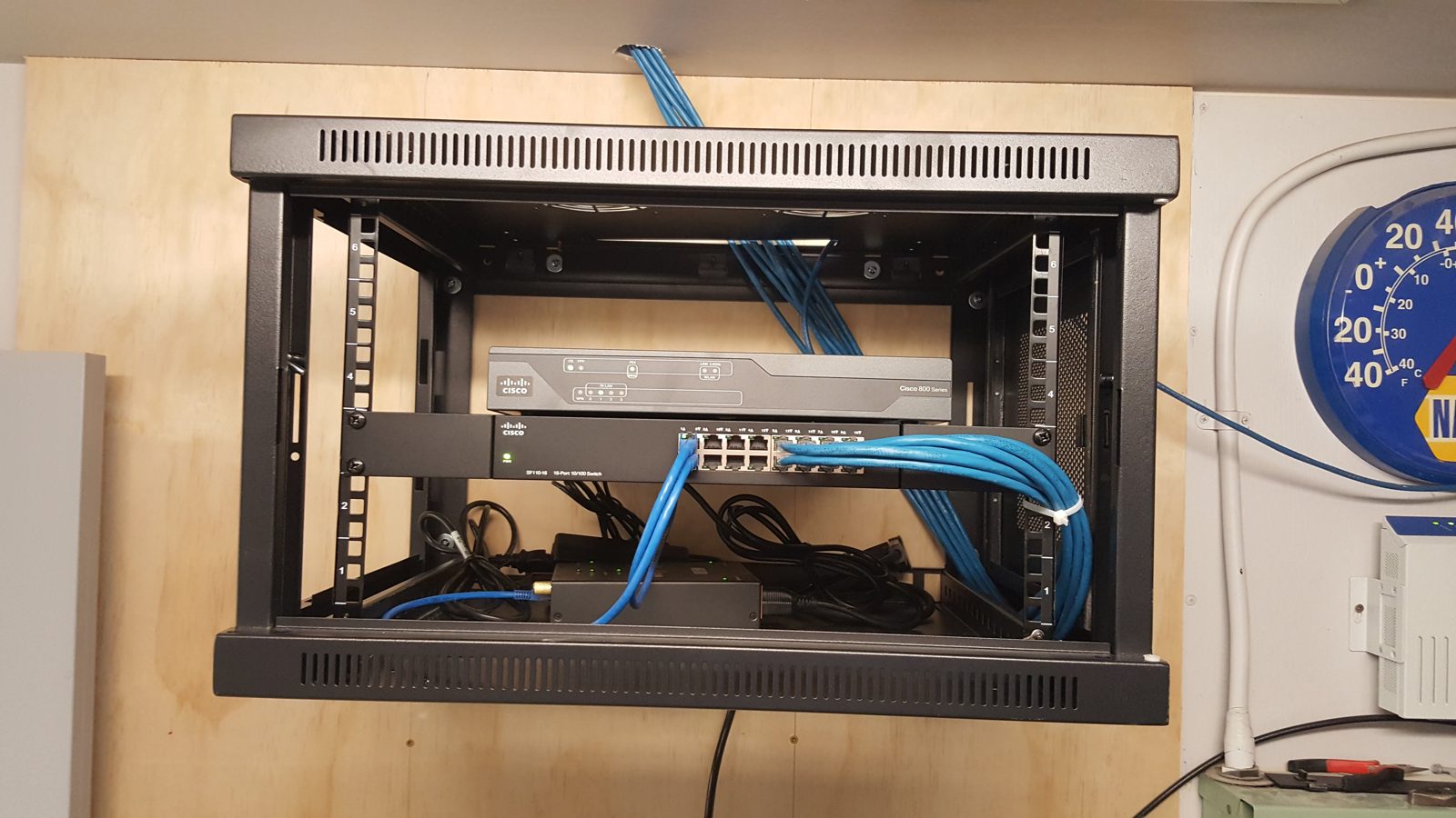 Wall cabinet switch blue cabling installed by All Soul Tech in Colorado