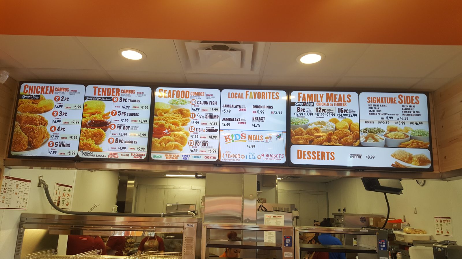 Chicken restaurant menu wall installed by All Soul Tech in Colorado