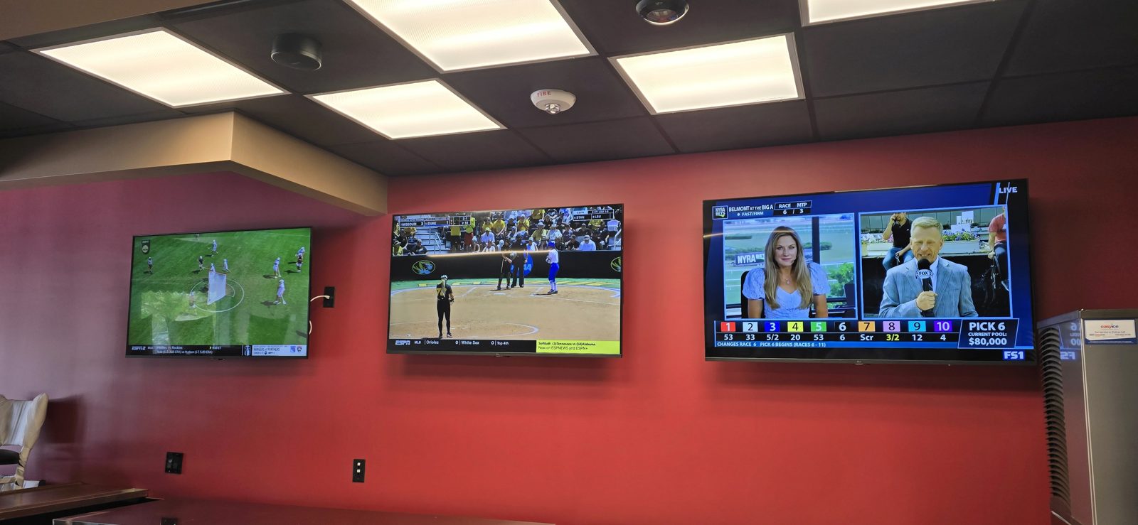 Three TV row red wall installed by All Soul Tech in Colorado