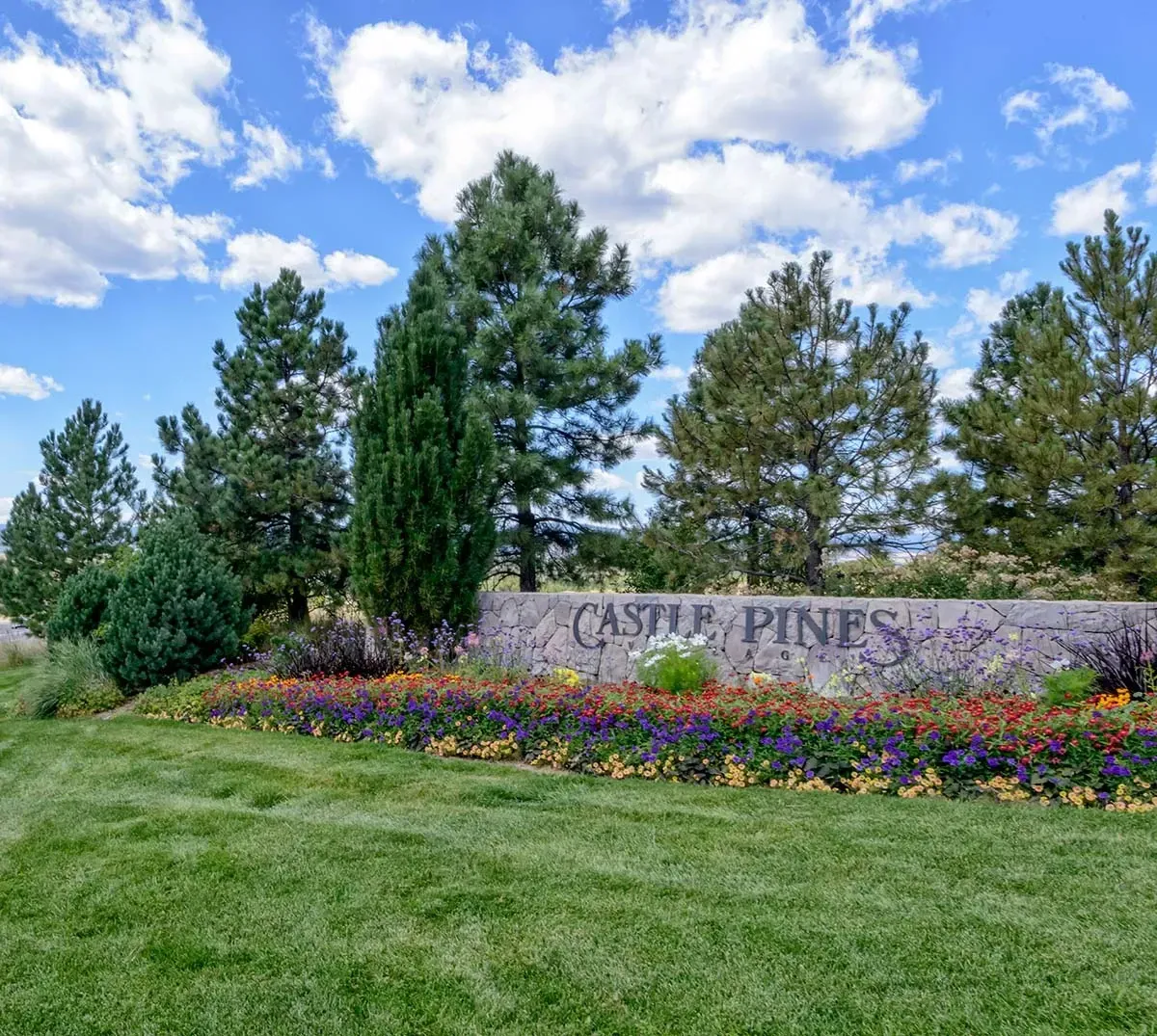 Cherry Hills Village grand estate frontage with manicured lawns and mountain views