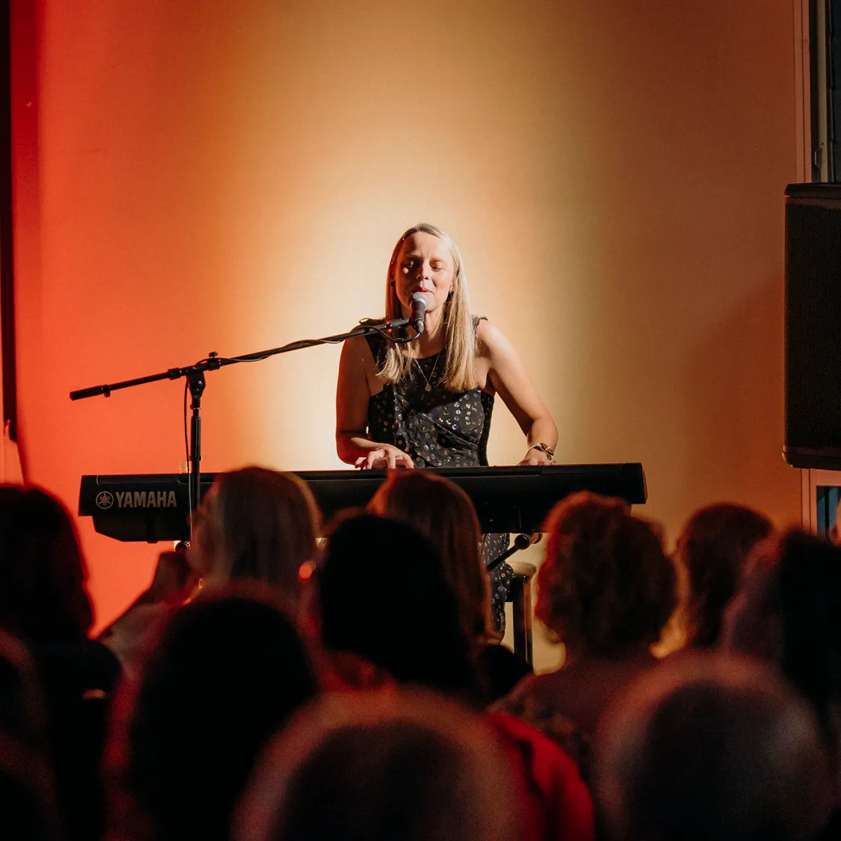 Woman laughing out loud at an event