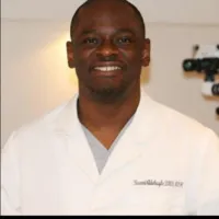 a room with a piano and chairs