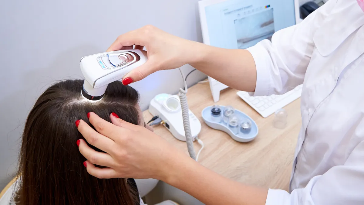 person sitting on chair in front of tree