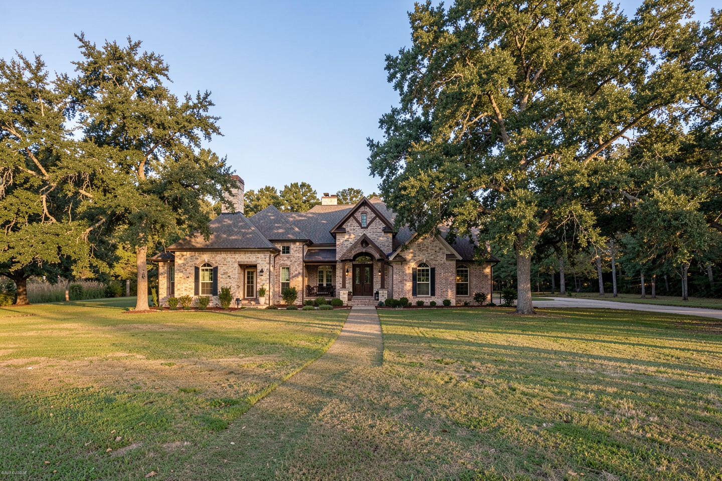 Custom stone and brick home on a wooded half-acre lot in Fairview, TX