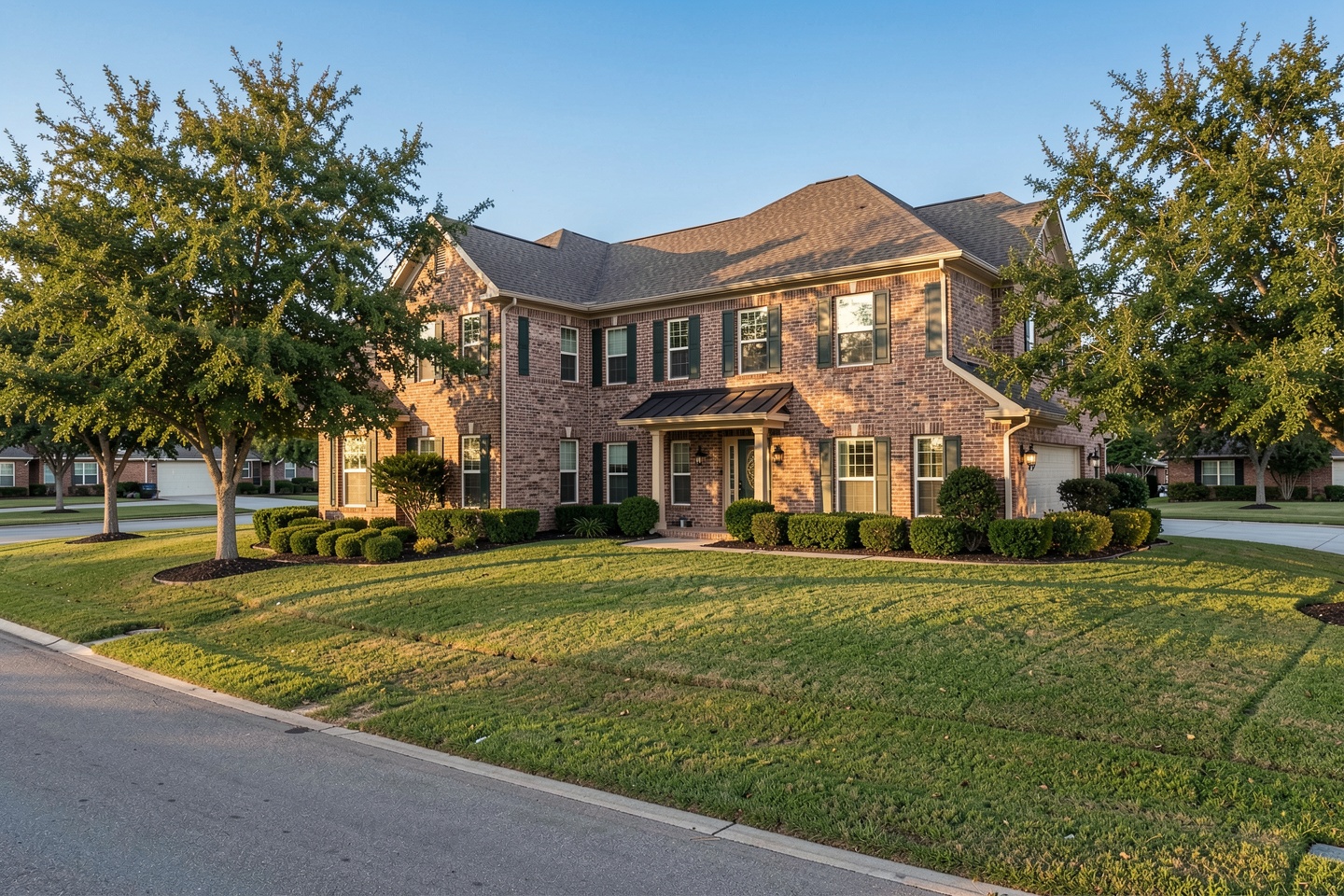 Large two-story brick home with mature landscaping in Murphy, TX