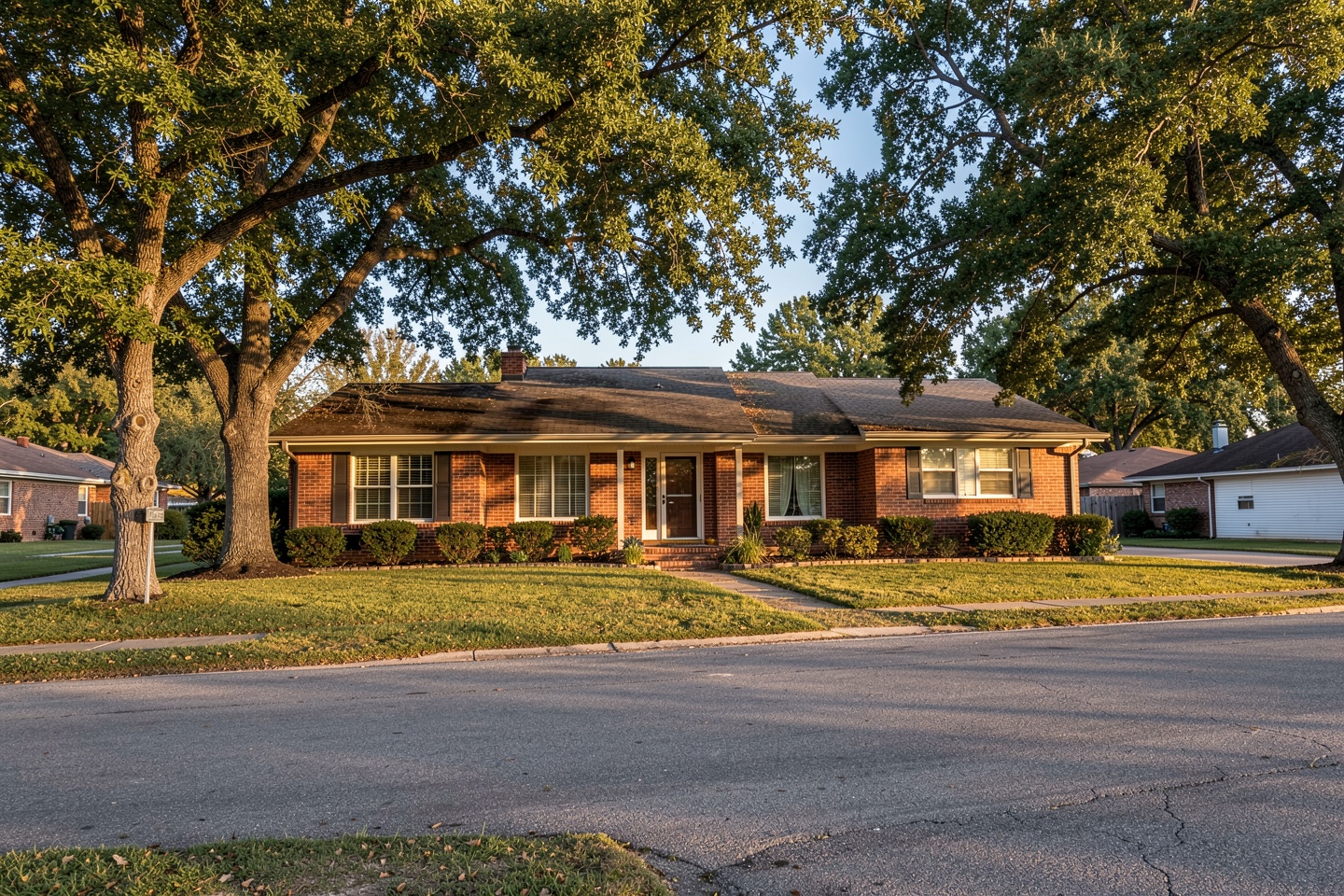 Single-story 1970s brick ranch home under mature trees in Duncanville, TX