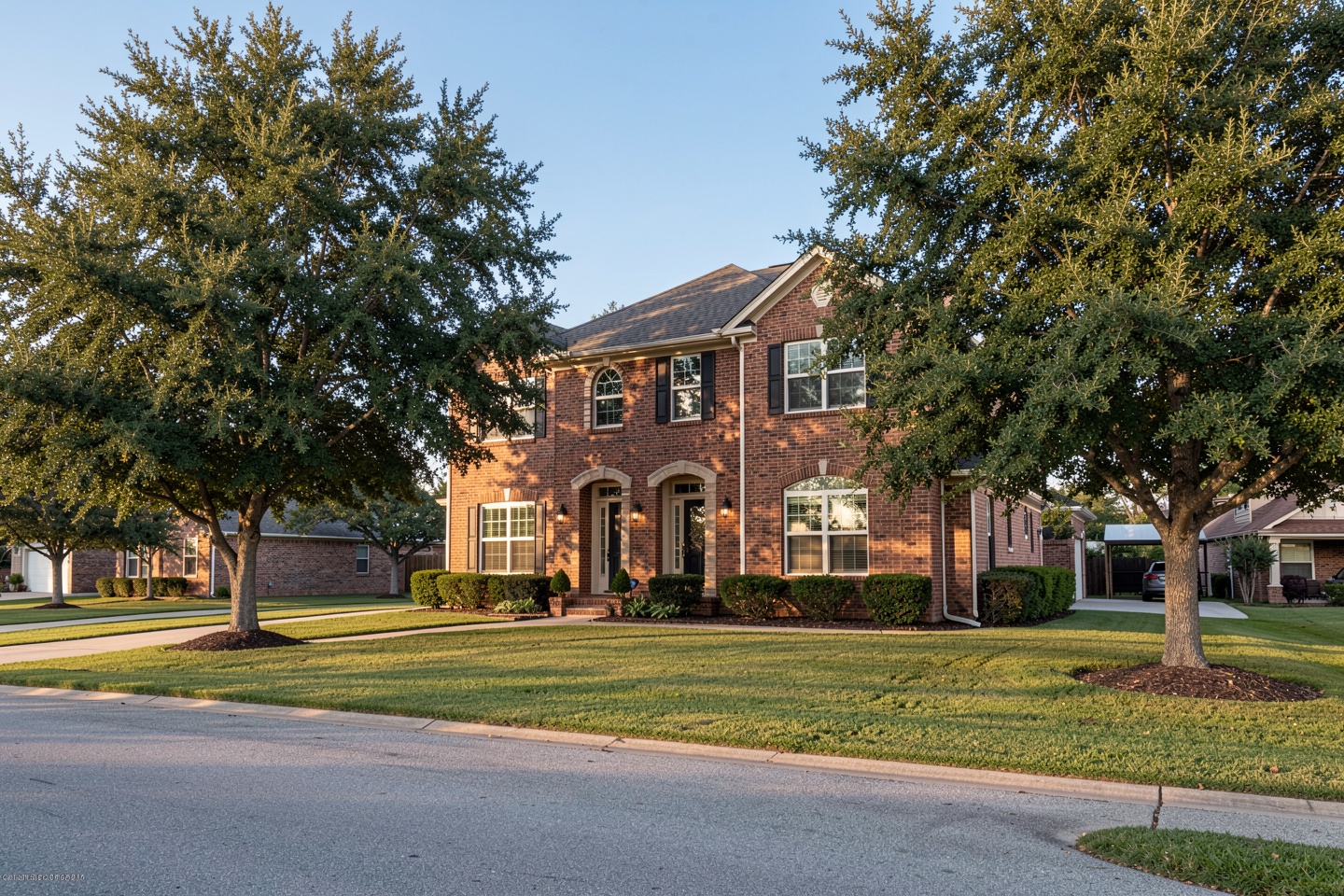 Established two-story brick home with mature trees in Corinth, TX