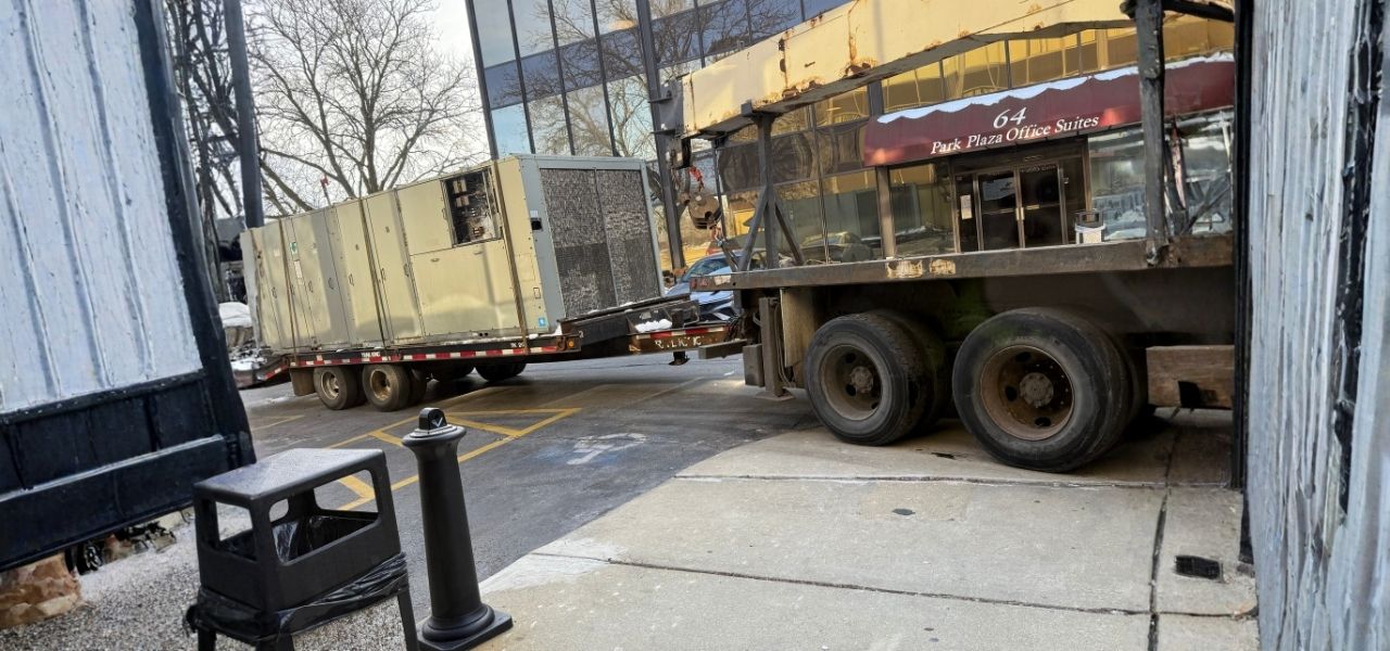 HVAC Services in Chicago Metro technician inspecting AC system