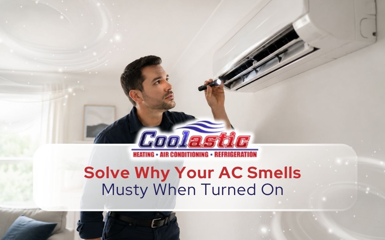 Technician checking why an AC smells musty when turned on