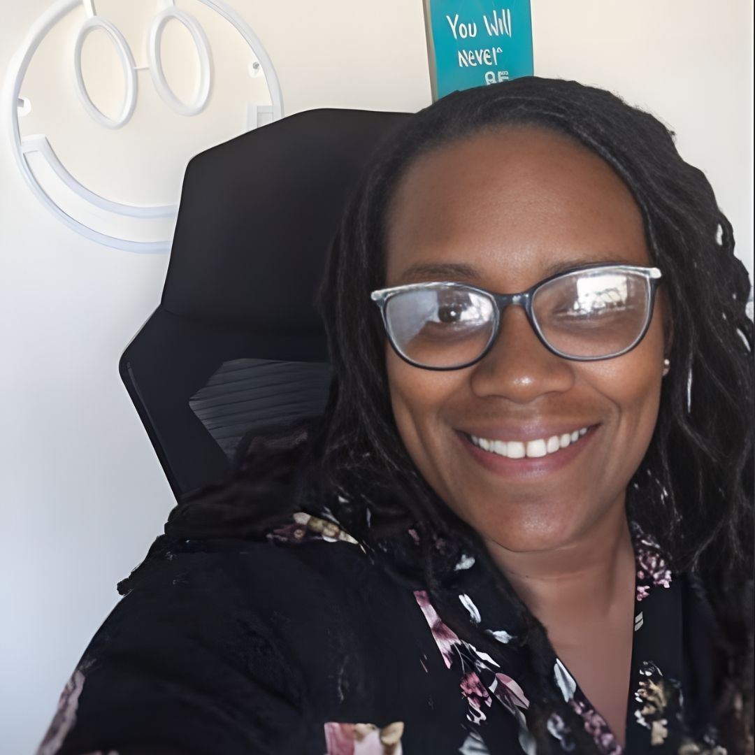 black and brown eyeglasses on book on brown wooden table