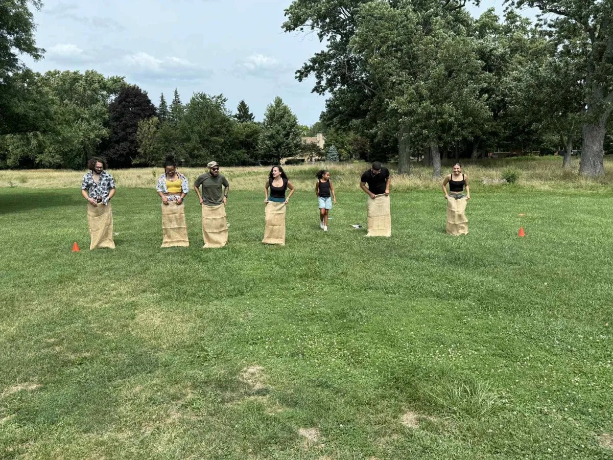 people sitting on grass field