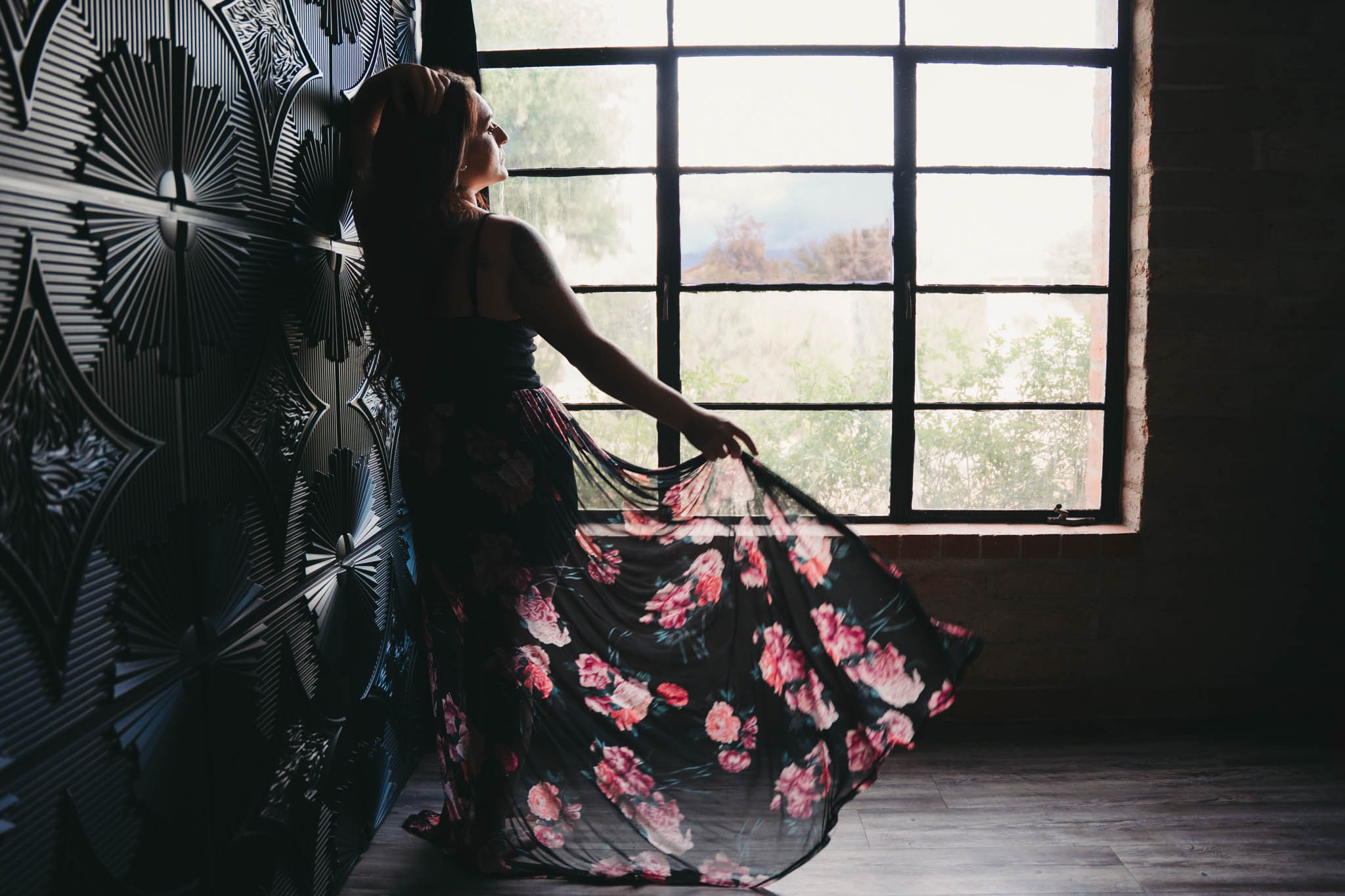 woman tossing skirt in window light