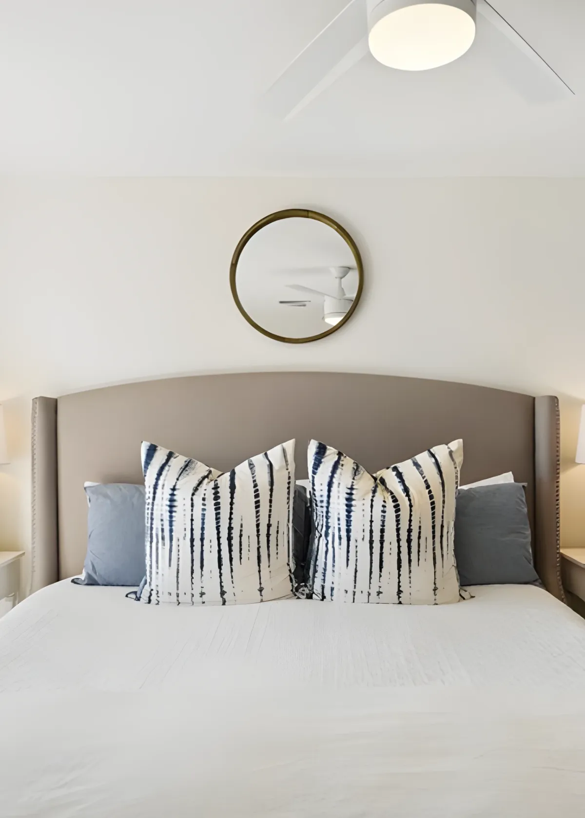 woman setting sheets on bed