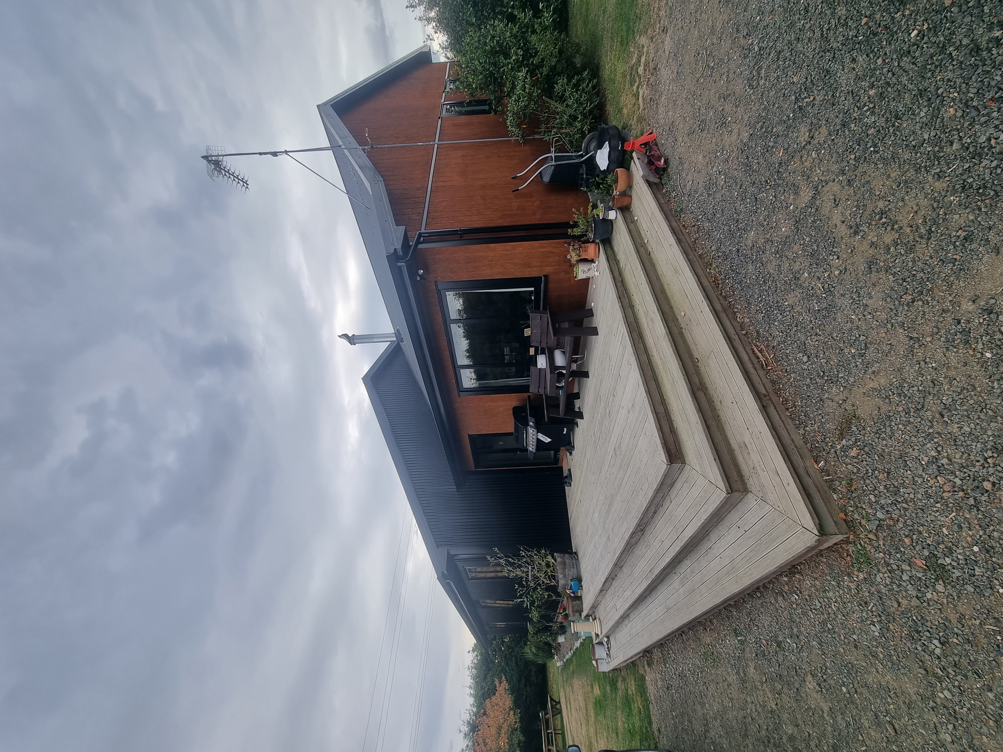 Timber deck and outdoor living area built onto a rural Canterbury home by Opuke Small Builds