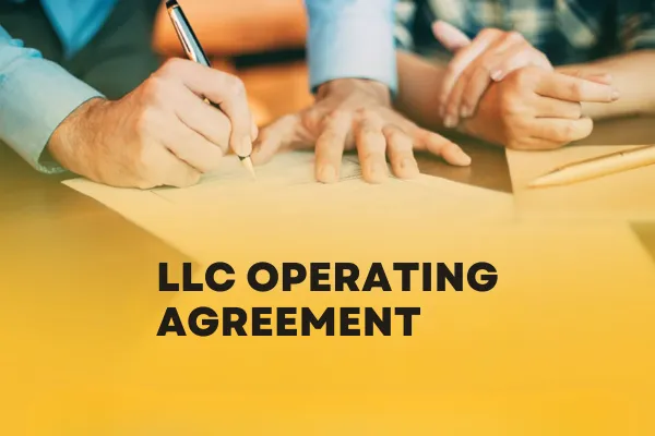 Hands signing an LLC operating agreement
