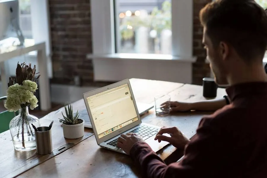 Rhode Island business owner reviewing contracts on a laptop