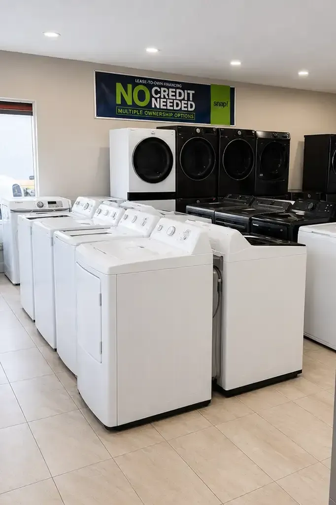 High-quality Whirlpool or LG stackable washer and dryer set in a clean showroom