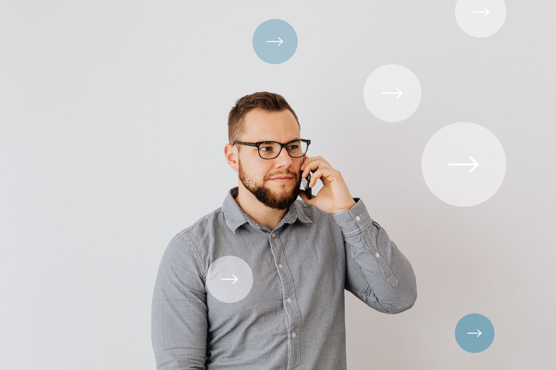Professional man talking on smartphone with overlay arrow graphics, symbolizing communication.