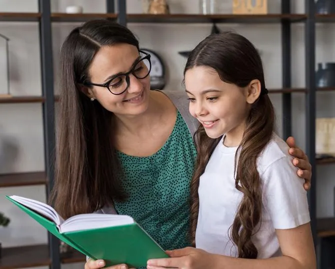 Reading tutor and girl with reading struggles.