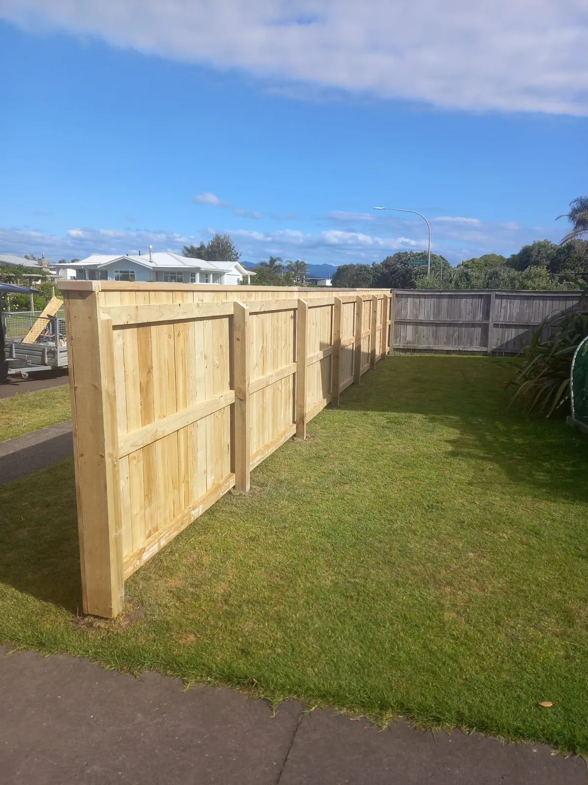 Timber boundary fence installation on a residential Whakatane property