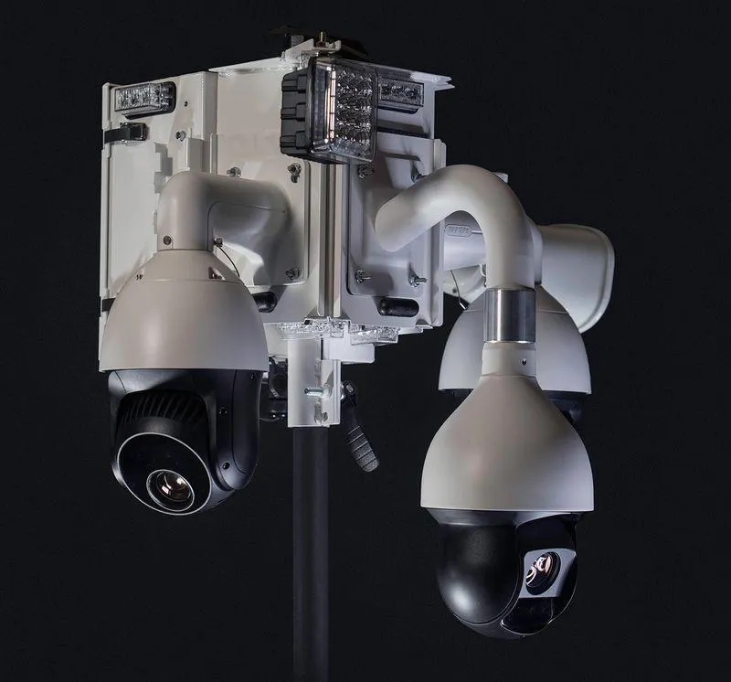 High-quality security camera mount featuring multiple camera units and integrated lighting, designed for versatile installation on walls, poles, or tripods, suitable for indoor and outdoor surveillance.