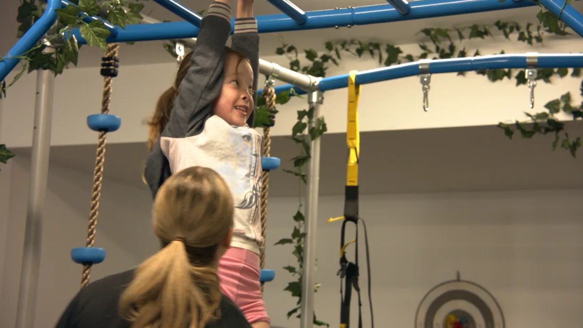 child on monkey bars