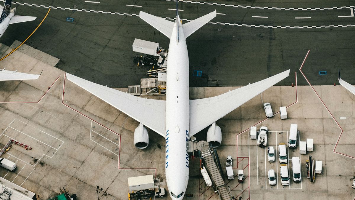 A cargo aircraft loaded with freight containers on the apron — the airfreight dispatch stage where the export documents fly with the cargo.