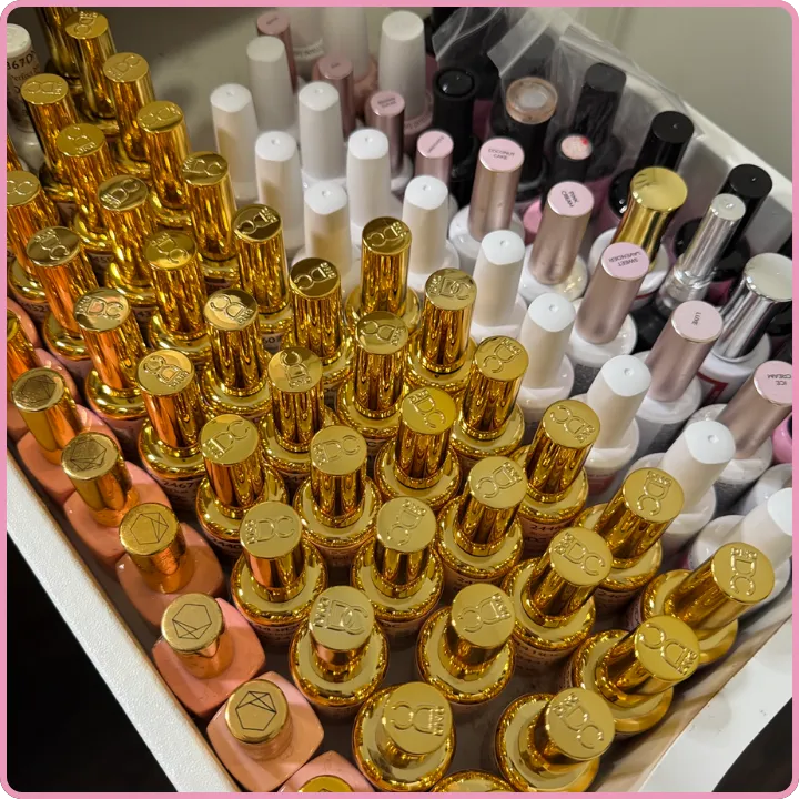A photo of a drawer full of various luxury gel polishes