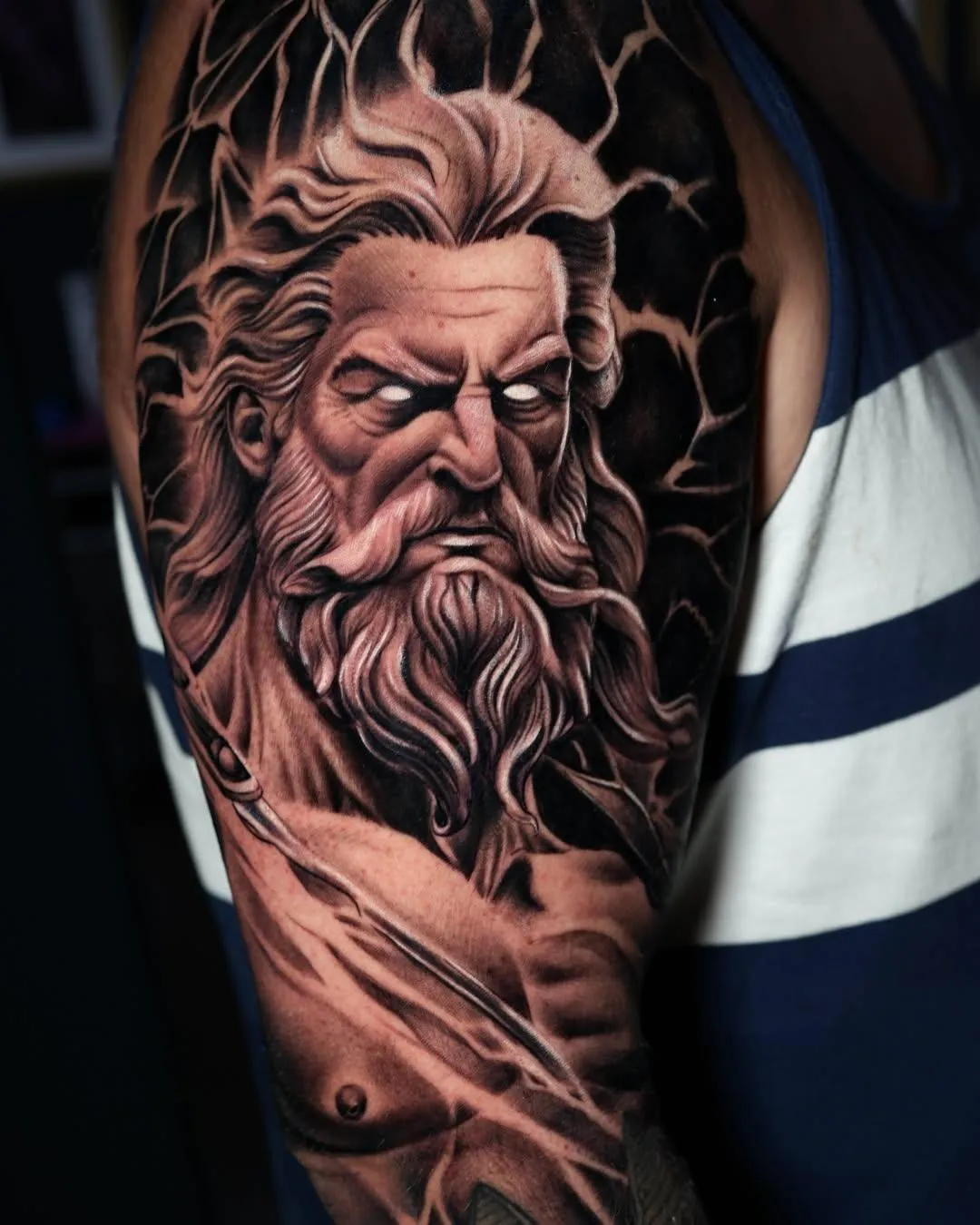 person in blue denim shorts and white nike sneakers standing on gray concrete floor