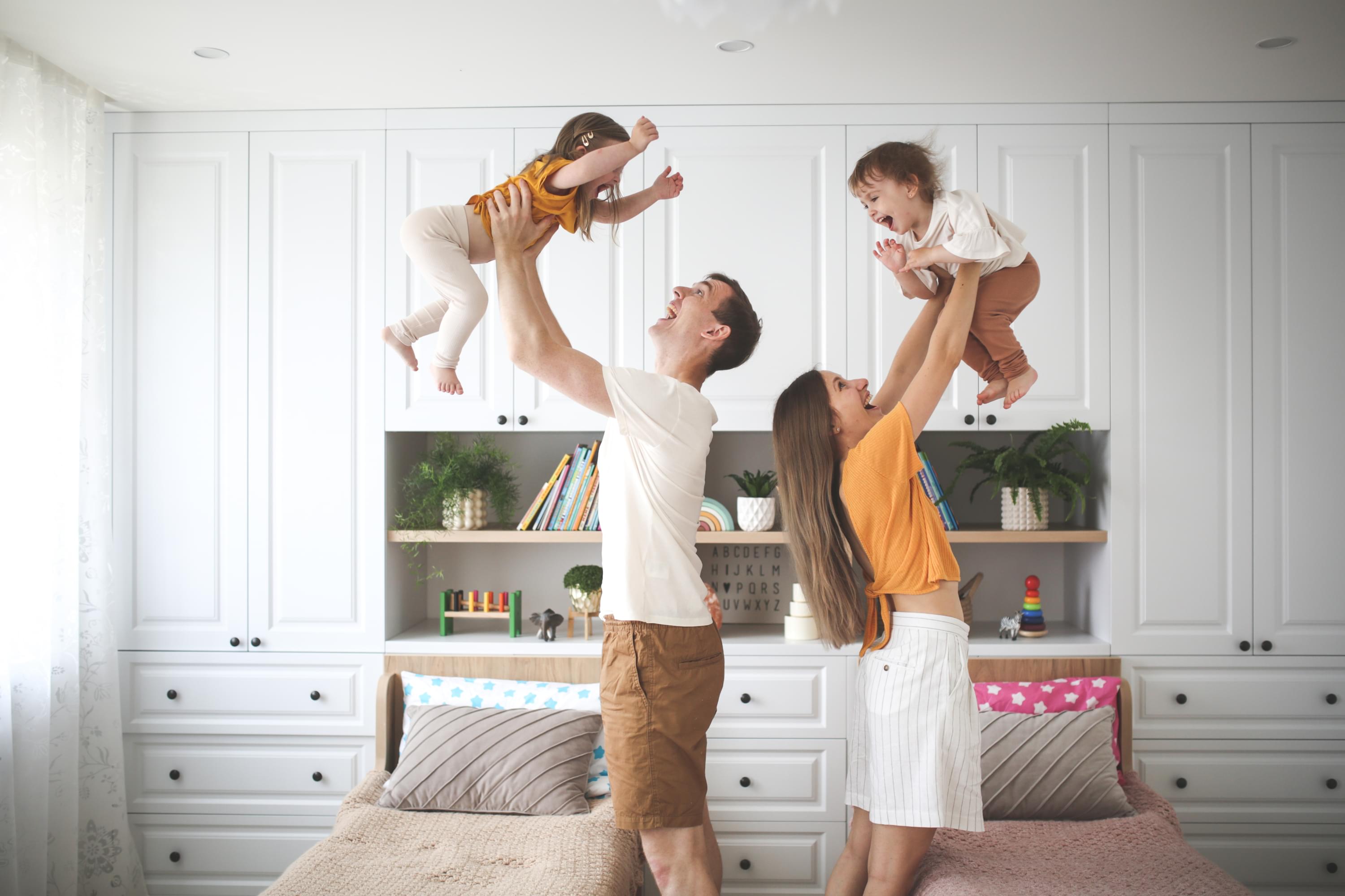 Parents playing with their daughter and son