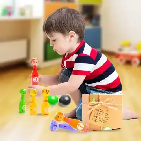 a kid playing aGreatLife mini Bowling 