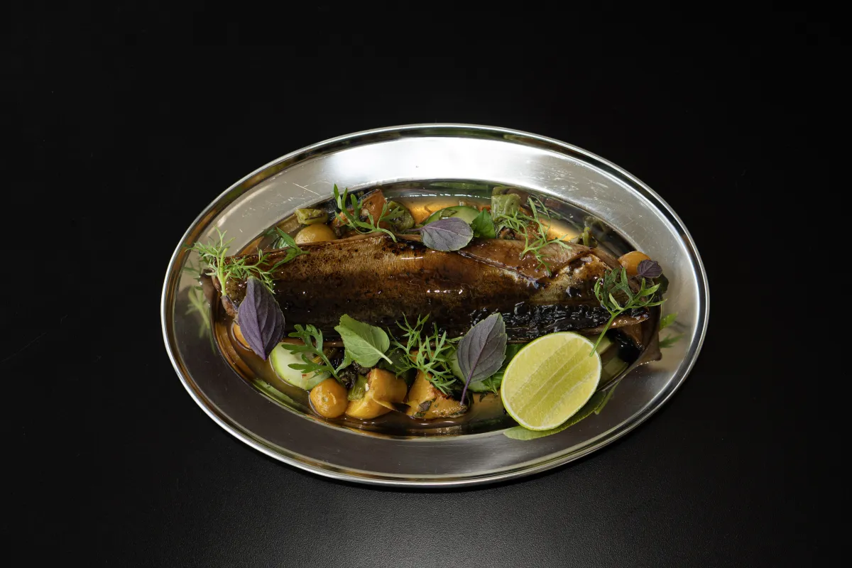 Beautifully plated dish served in a modern restaurant setting.