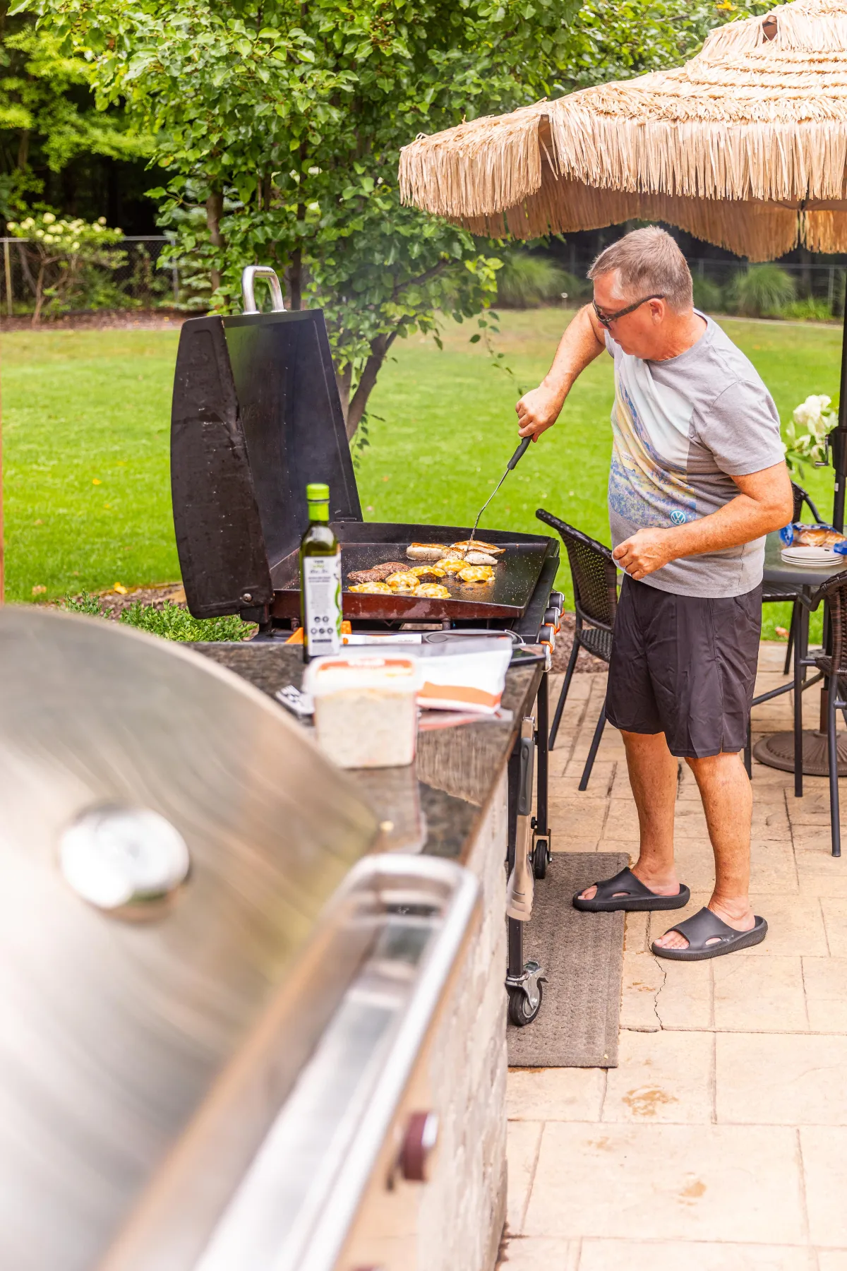 Outdoor grilling on the Blackstone at Fennville MI luxury vacation rental Swimming in the Sunset