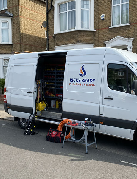 Plumber with customer n the kitchen