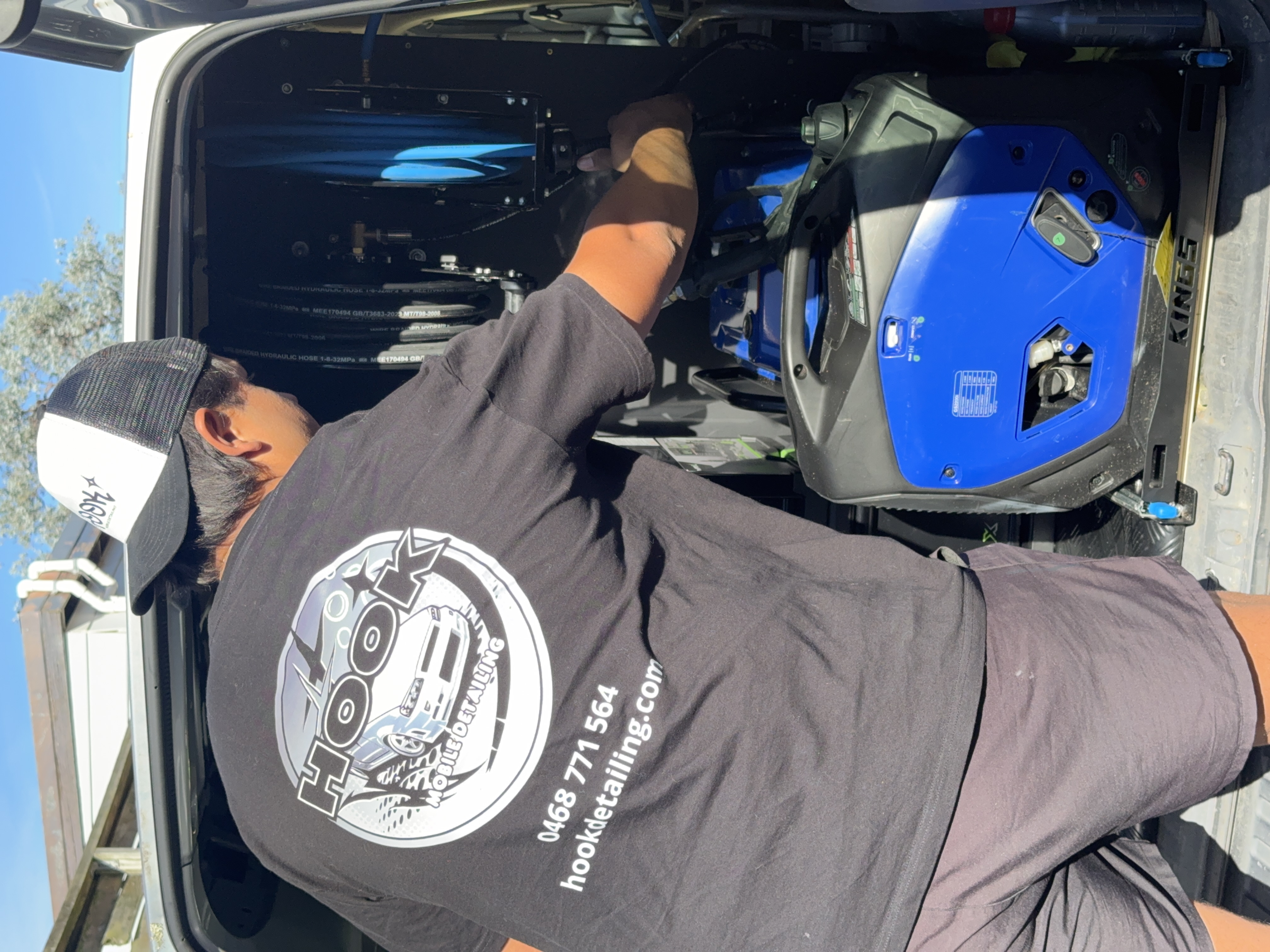 detailer-reaching-into-van-set-up
