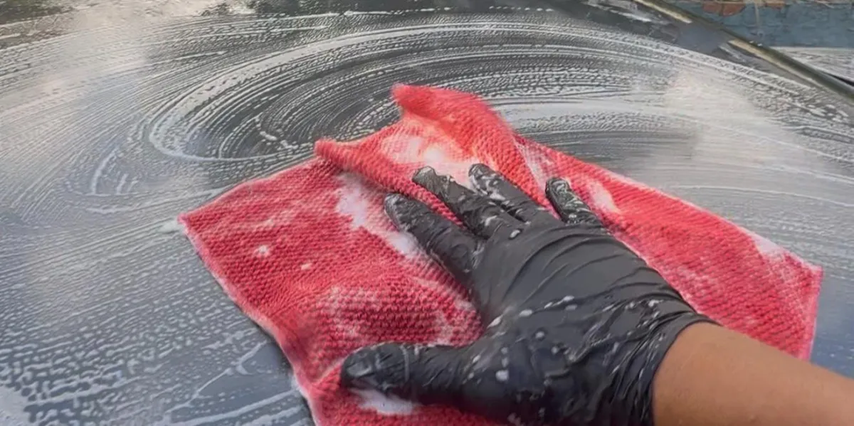 cal mitt on car paint to remove embedded particles