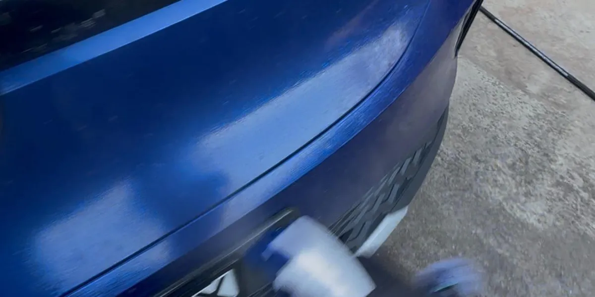 spraying bug and tar remover on front car