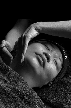 woman wearing black strapless dress holding on waist