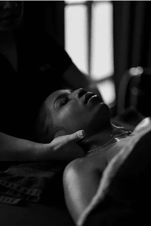 woman in white dress with white ribbon on head
