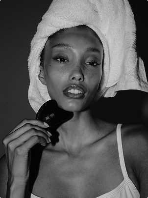 black and silver office rolling chair beside mirror