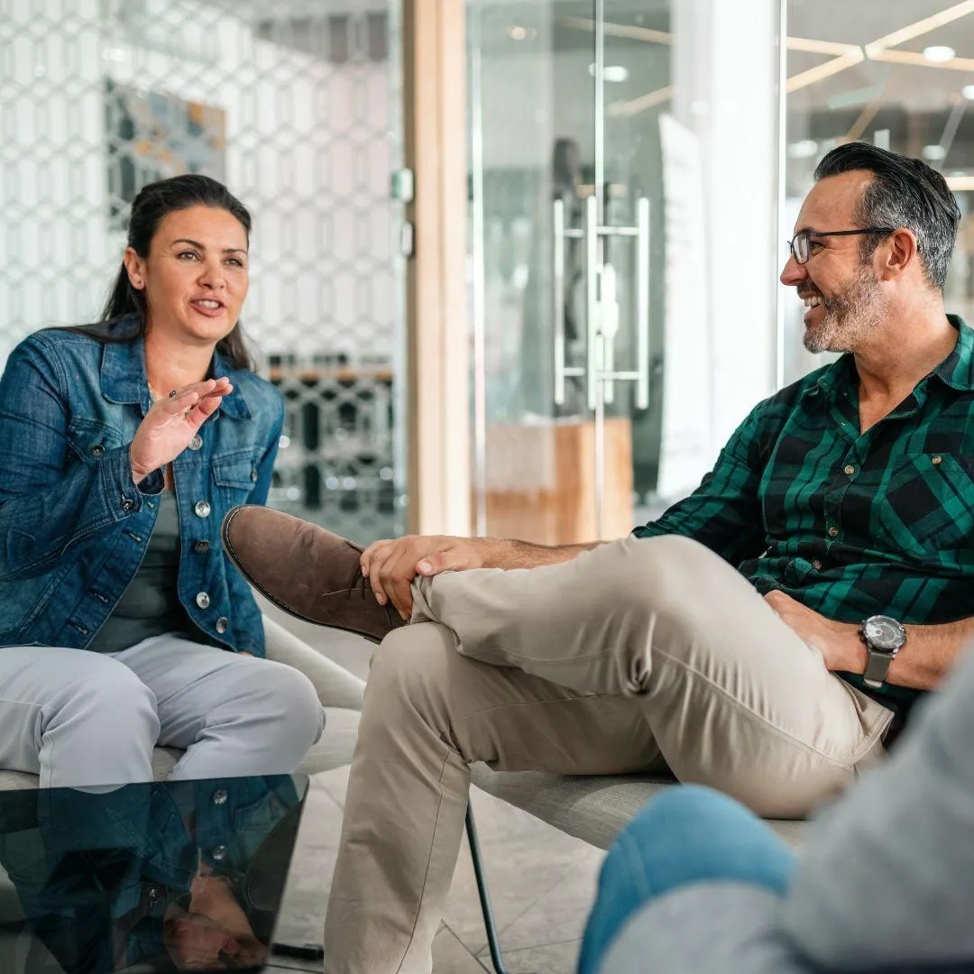 Compassionate therapist engaging in a supportive counseling session with a client