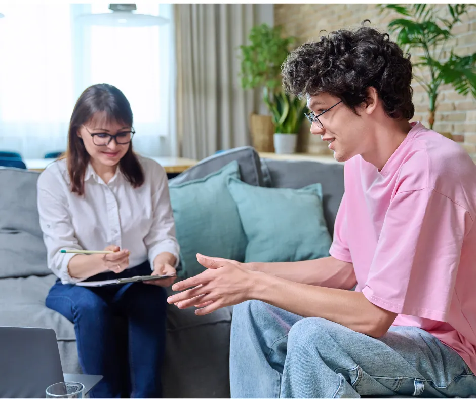 Compassionate therapist engaging in a supportive counseling session with a client