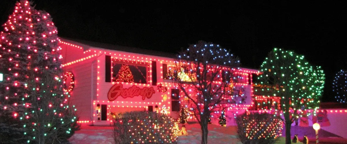 House decorated with bright Christmas lights and glowing trees for the holidays in Brownsburg, Indiana.