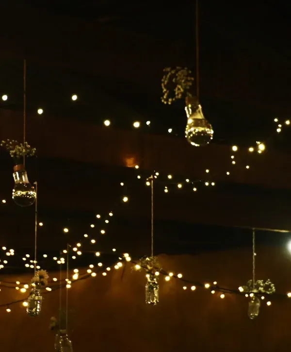 Warm indoor string lights and hanging decorations creating a cozy holiday ambiance in Speedway, Indiana.