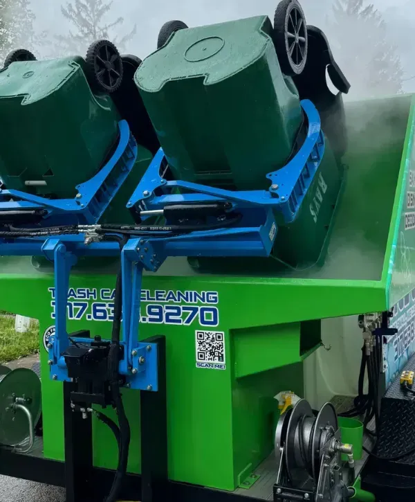 Trash can cleaning machine lifting bins for sanitation