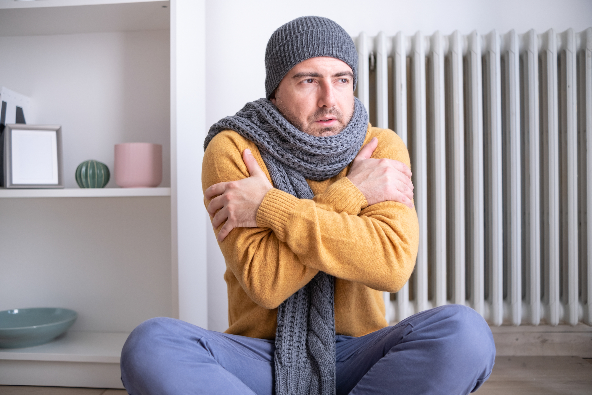 Man shivering in need of emergency HVAC repair for Woodburn HVAC