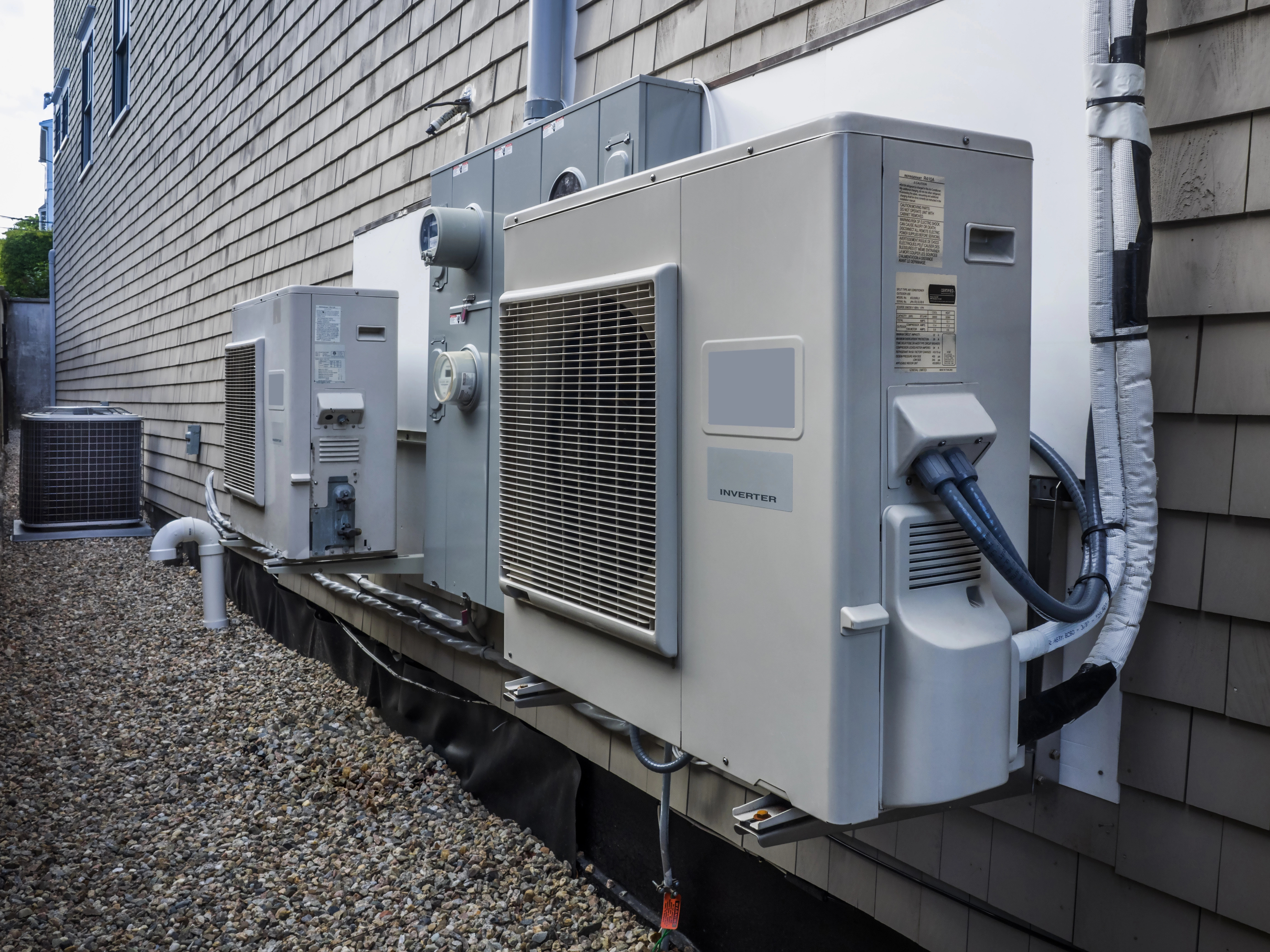 Outdoor heat pump system installation by Woodburn HVAC