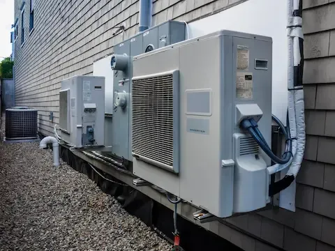 Outdoor heat pump system installation by Woodburn HVAC